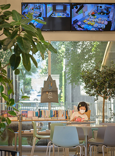 A child enjoys a book at Milkbook.